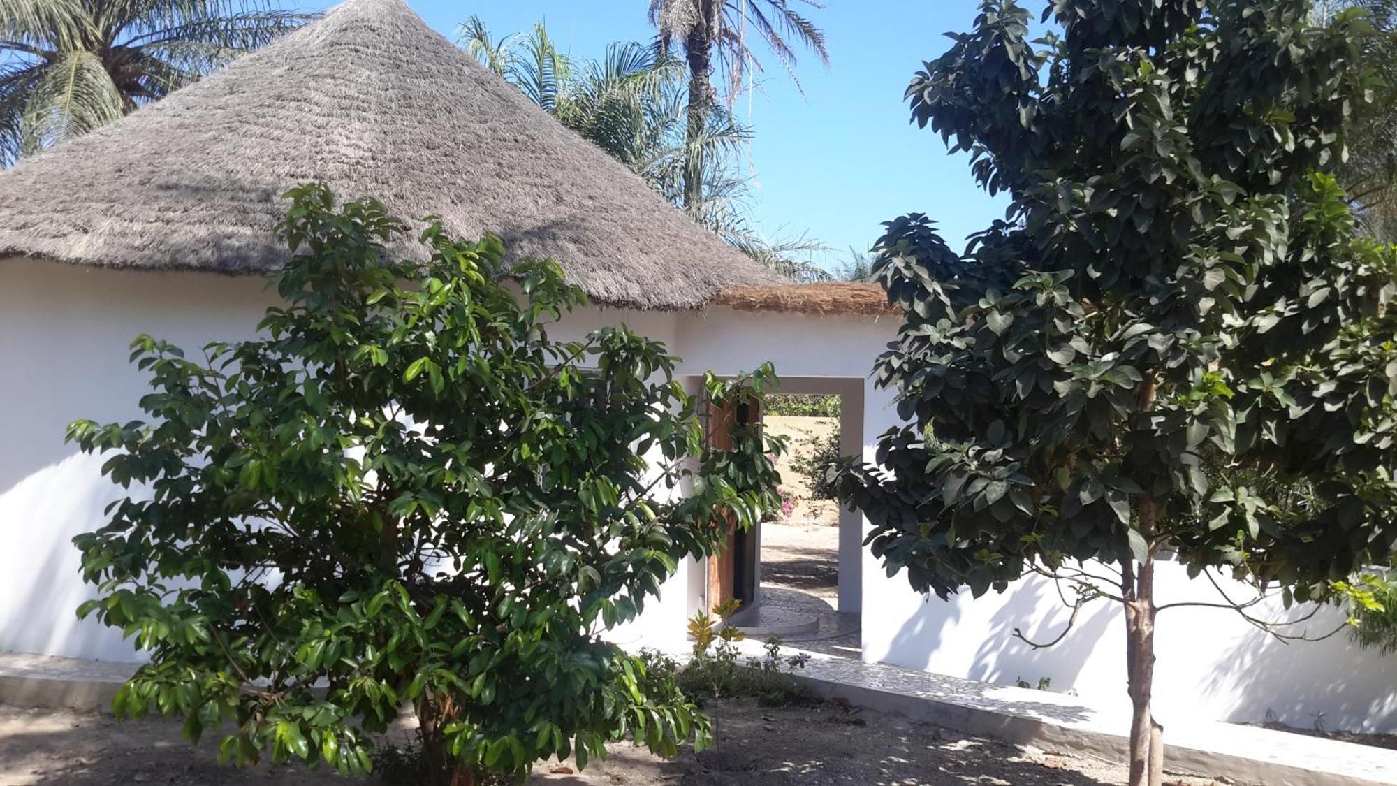 Case traditionnelle diola au bord de l'océan Cap Skirring Extérieur photo